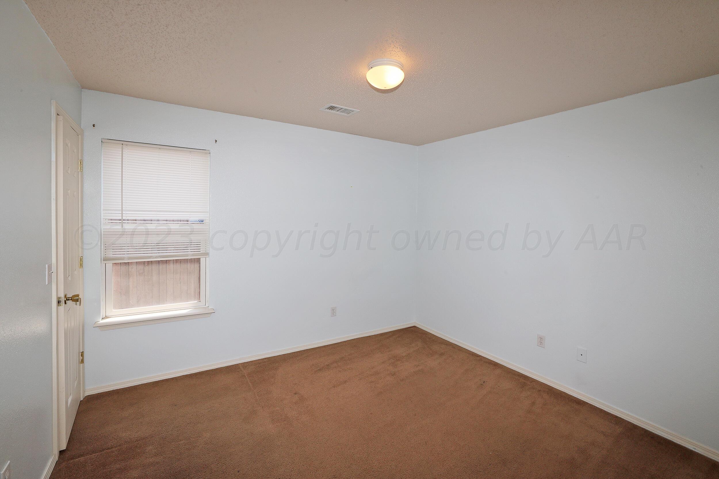 1025 Ketler Street Amarillo, TX 79104 - Photo 18 of 29 an empty room with a window