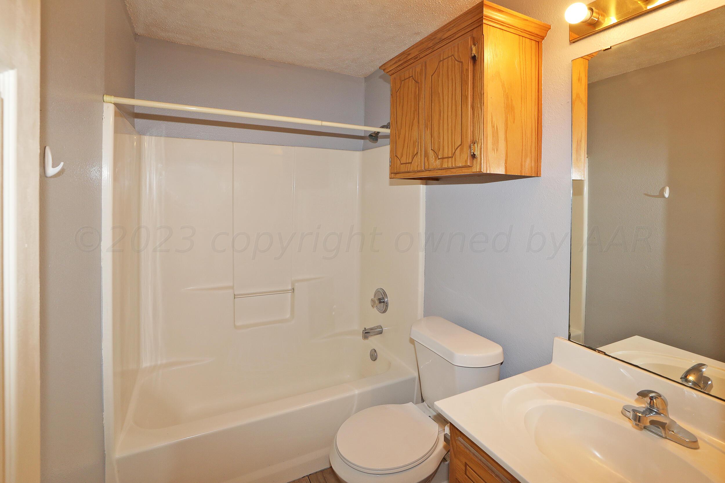 1025 Ketler Street Amarillo, TX 79104 - Photo 23 of 29 a bathroom with a sink toilet and shower