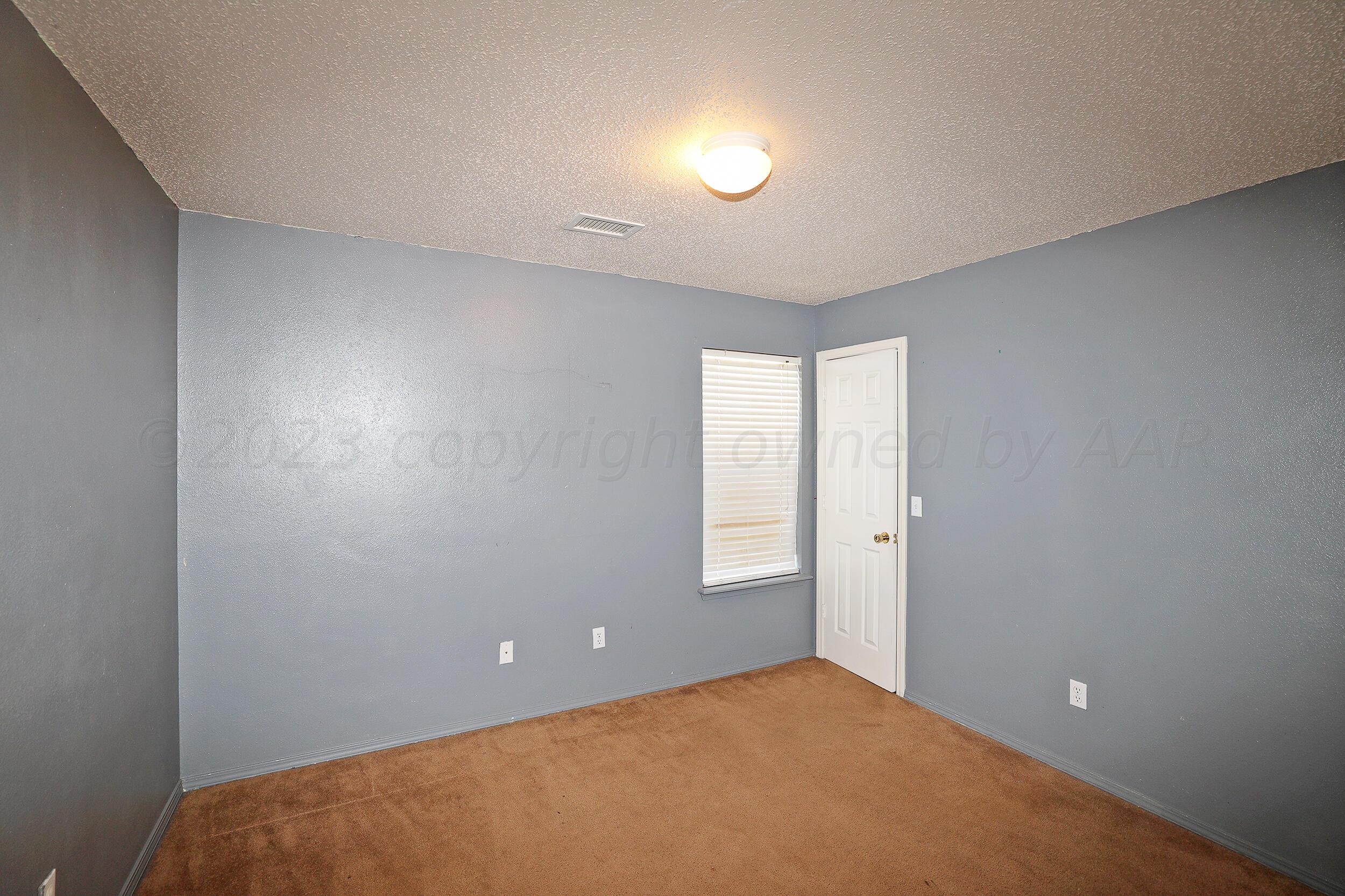 1025 Ketler Street Amarillo, TX 79104 - Photo 24 of 29 a view of an empty room with a window