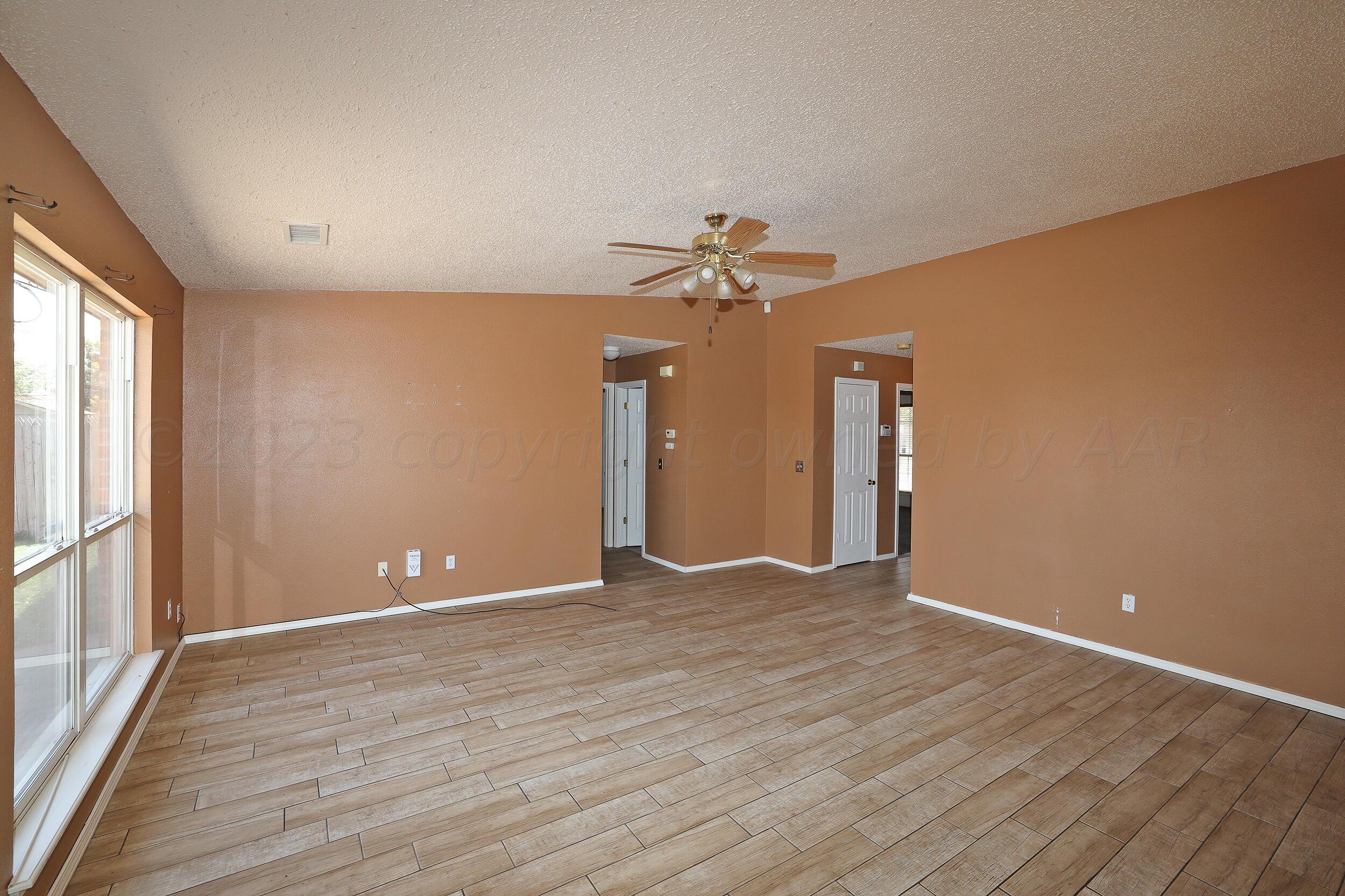 1025 Ketler Street Amarillo, TX 79104 - Photo 6 of 29 a view of an empty room with a window