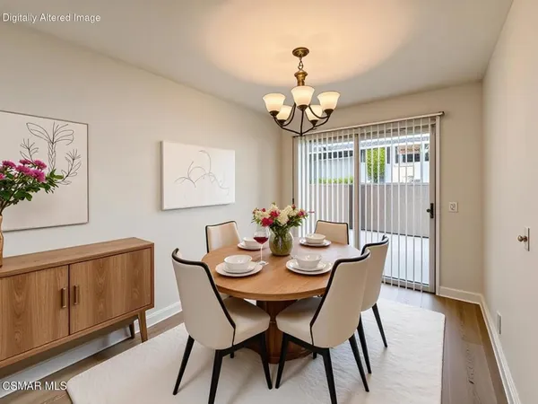 a kitchen with stainless steel appliances white cabinets and white appliances