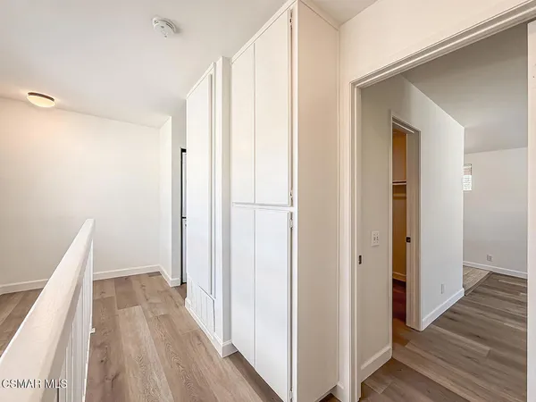 an empty room with wooden floor