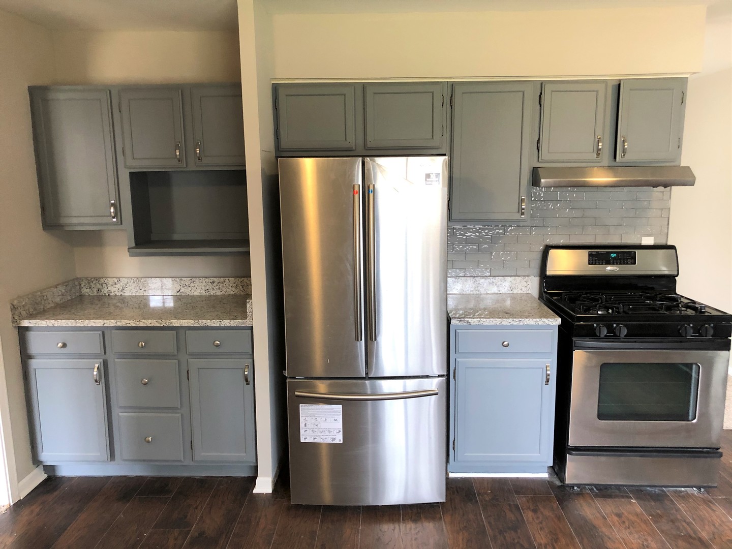 70 Pueblo Road Montgomery, IL 60538 - Photo 5 of 13 a kitchen with a refrigerator sink and cabinets