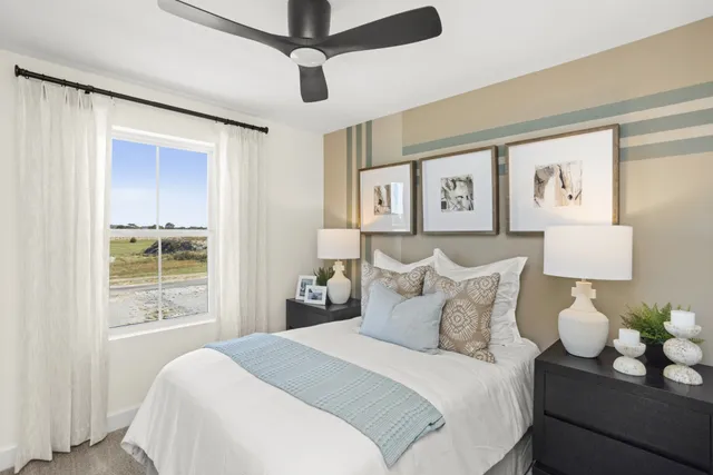 a bedroom with a bed and window