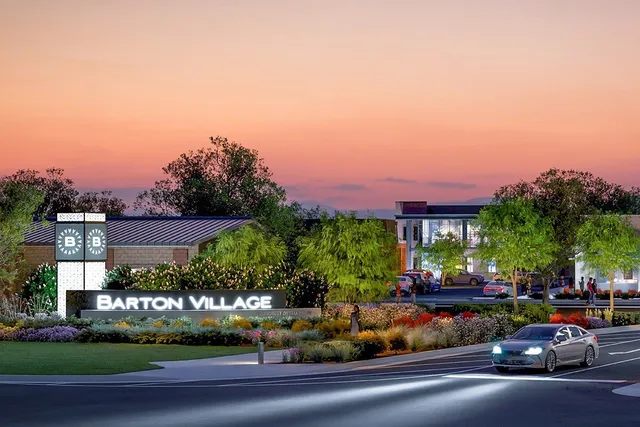 a view of a city street with a parked cars