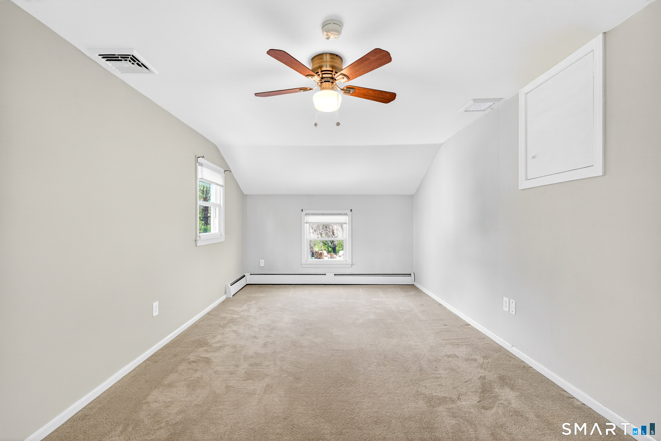 568 Wiese Road Cheshire, CT 06410 - Photo 30 of 40 an empty room with windows and ceiling fan