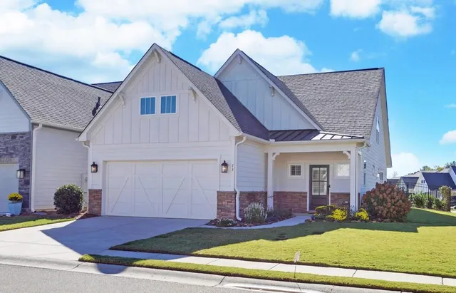 a view of house with yard