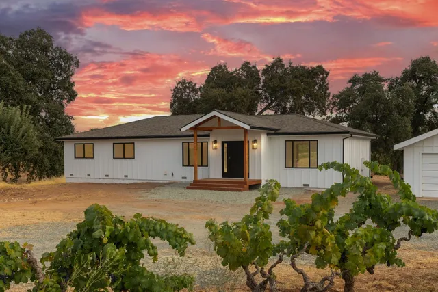 a front view of a house with a outdoor space