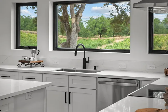 a kitchen with a sink and a window