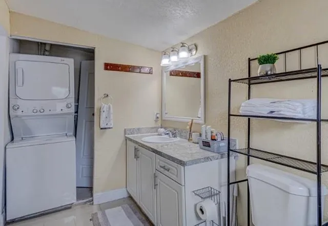 a bathroom with a sink vanity and a mirror