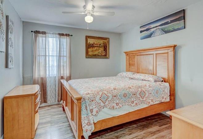 1105 West 34th Street Riviera Beach, FL 33404 - Photo 10 of 15 a bedroom with a bed and a window