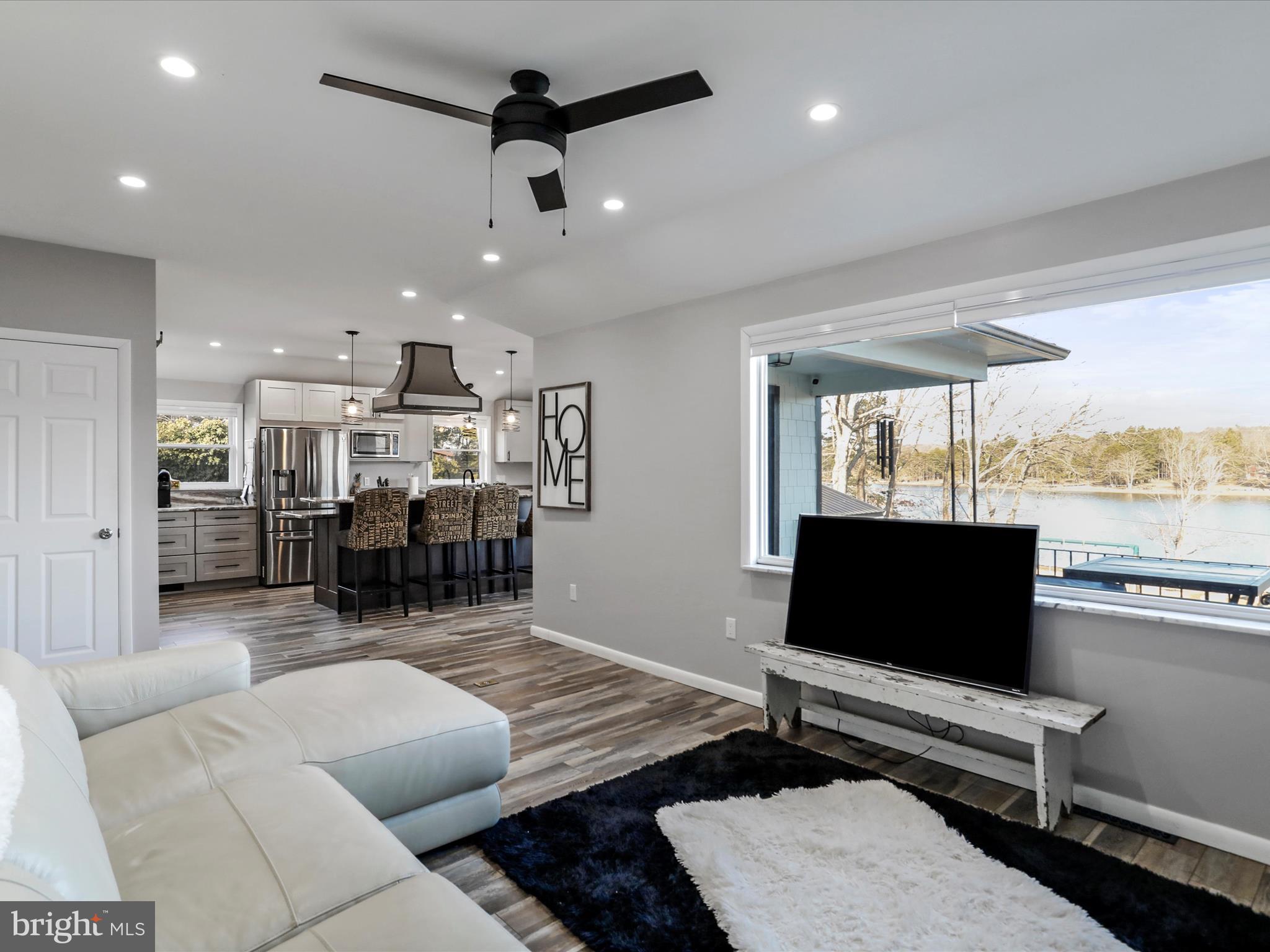 468 Pritts Road Swanton, MD 21561 - Photo 12 of 58 a living room with furniture and a flat screen tv