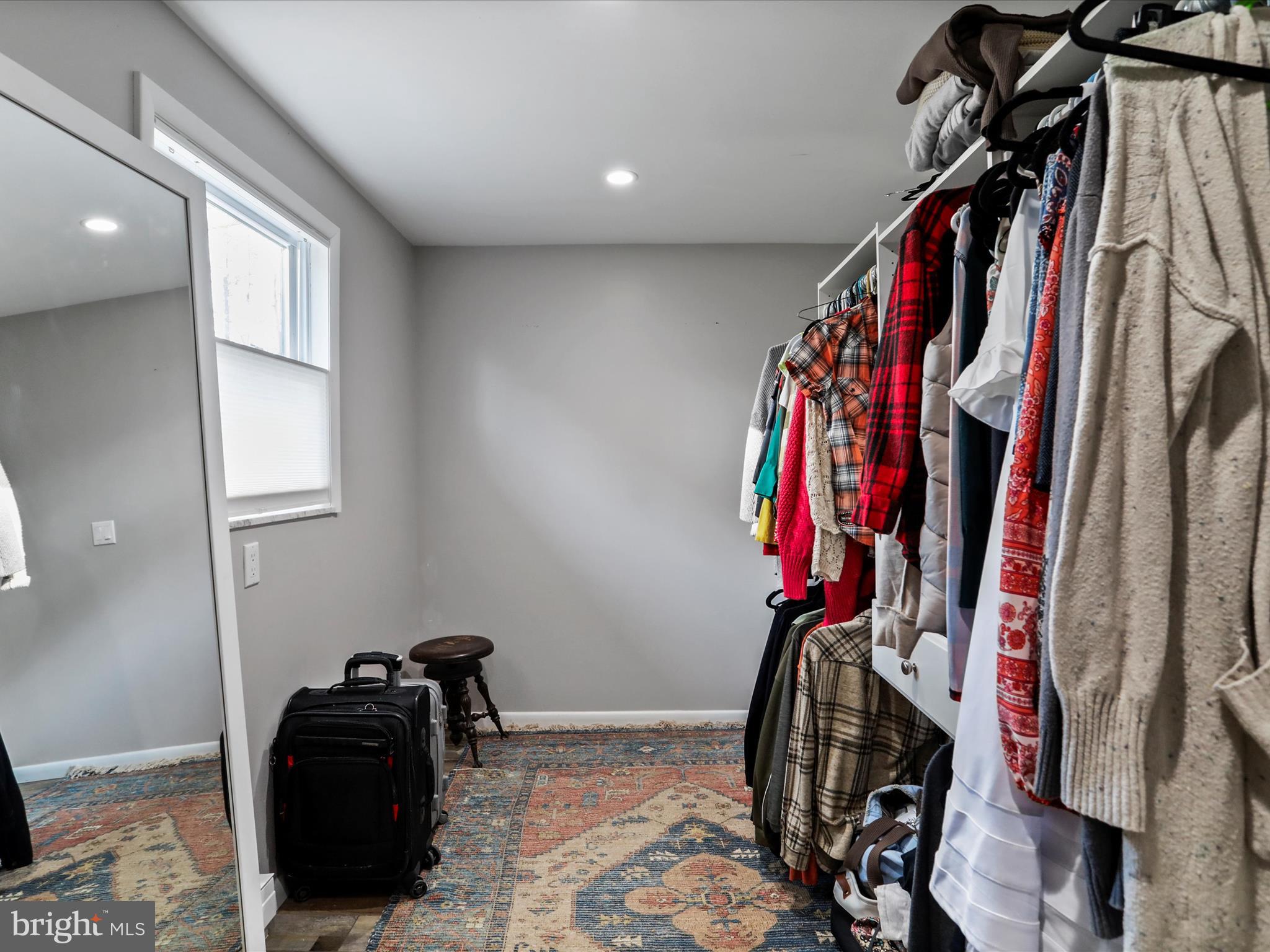 468 Pritts Road Swanton, MD 21561 - Photo 21 of 58 a view of walk in closet with clothes and shoes