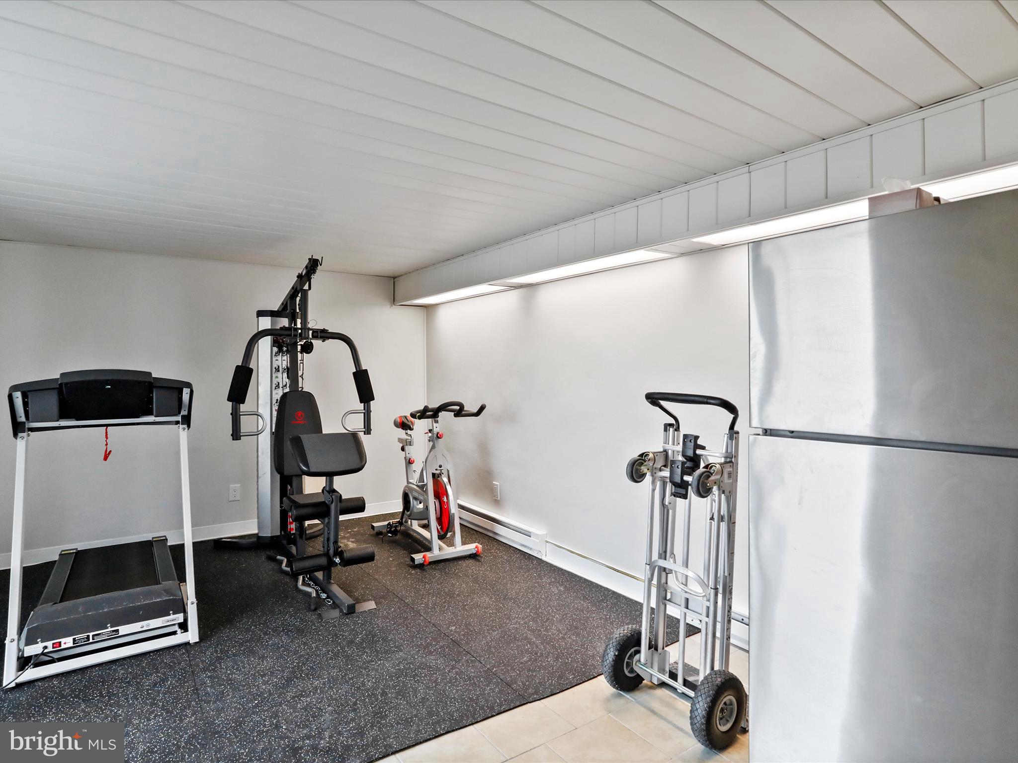 468 Pritts Road Swanton, MD 21561 - Photo 27 of 58 a view of a room with gym equipment