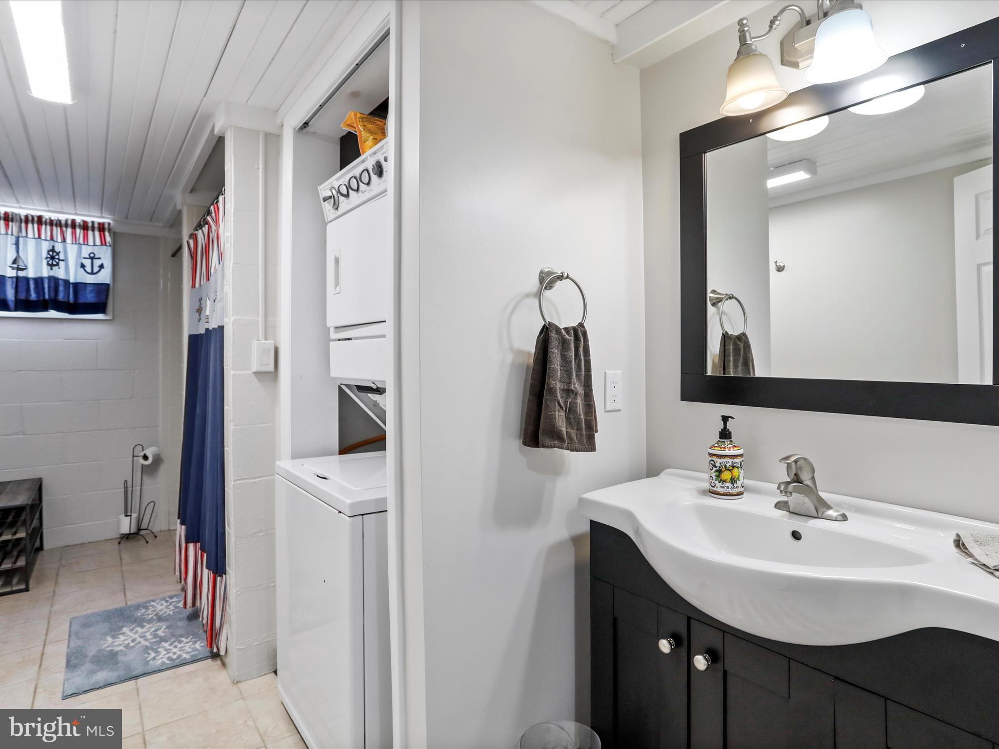 468 Pritts Road Swanton, MD 21561 - Photo 31 of 58 a bathroom with a sink a toilet and shower