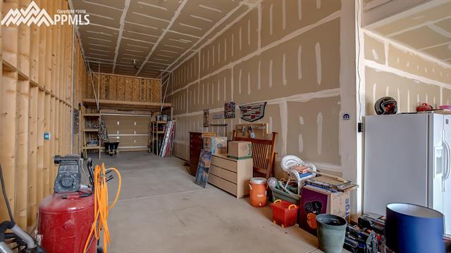 9232 Rockingham Drive Peyton, CO 80831 - Photo 35 of 35 Garage- 3 car tandem area with loft!