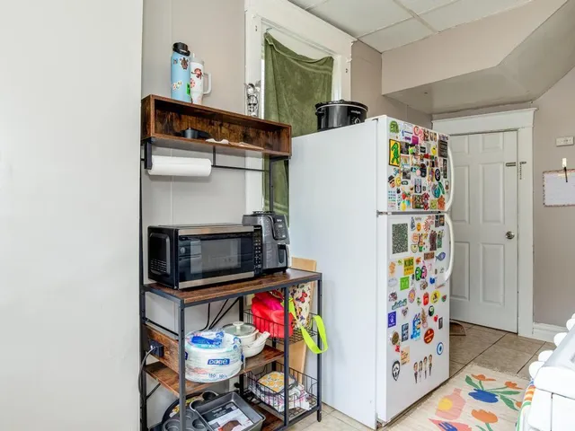 a kitchen with stainless steel appliances granite countertop a stove and a refrigerator
