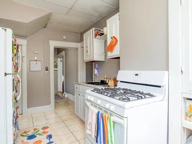 a bedroom with a bed and a mirror