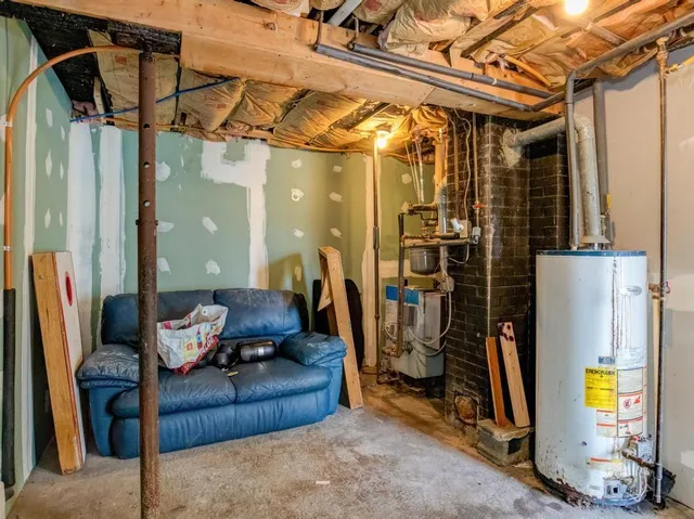 a living room with hardwood floor and a large window