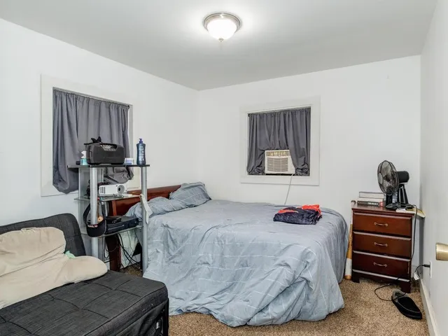 a bedroom with a bed and furniture