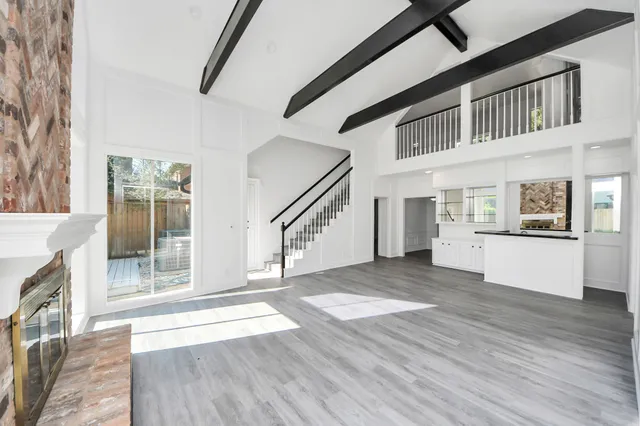 a view of an entryway with wooden floor