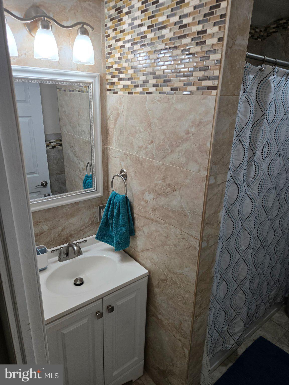 909 Bentley Road Lindenwold, NJ 08021 - Photo 8 of 15 Chic bathroom with elegant tile accents.