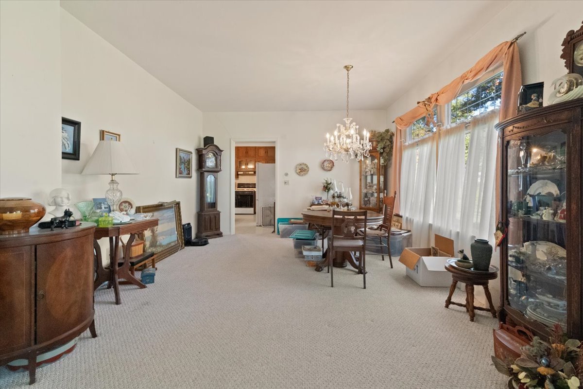 116 East Monaville Road Lake Villa, IL 60046 - Photo 13 of 51 a living room with furniture and a chandelier