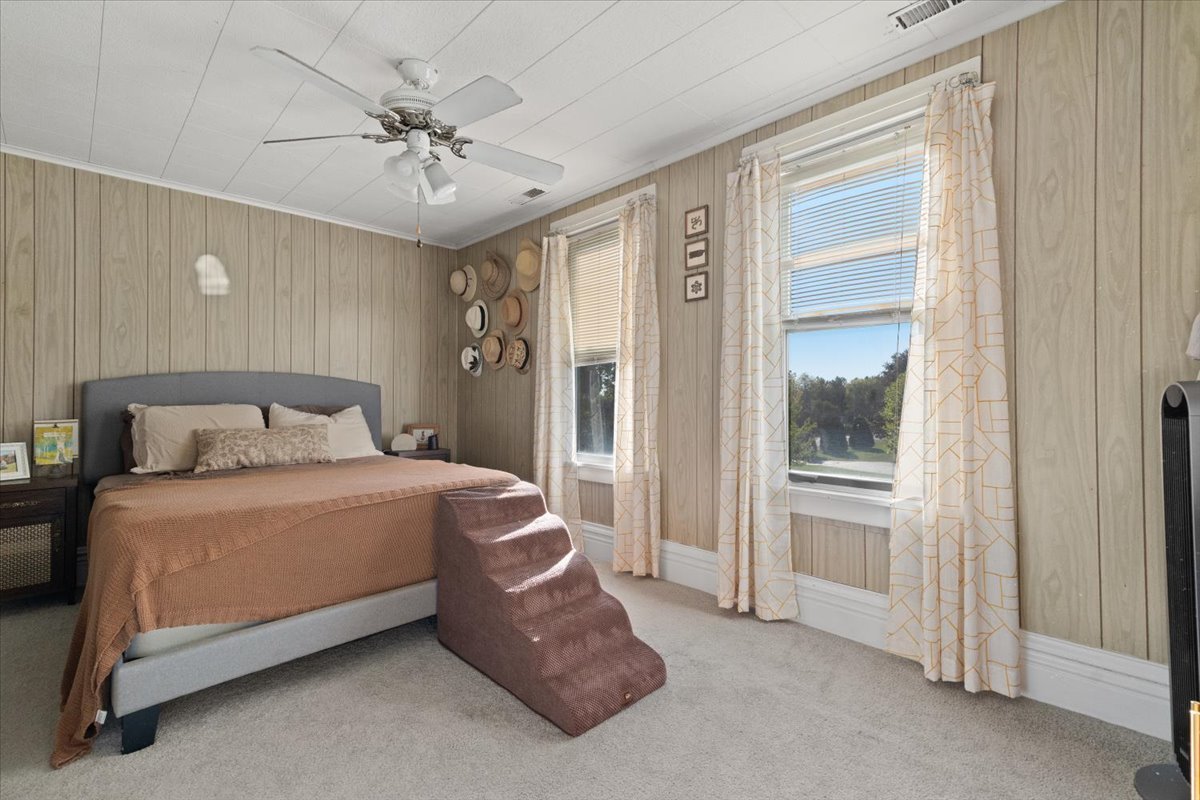 116 East Monaville Road Lake Villa, IL 60046 - Photo 33 of 51 a spacious bedroom with a bed and a chandelier