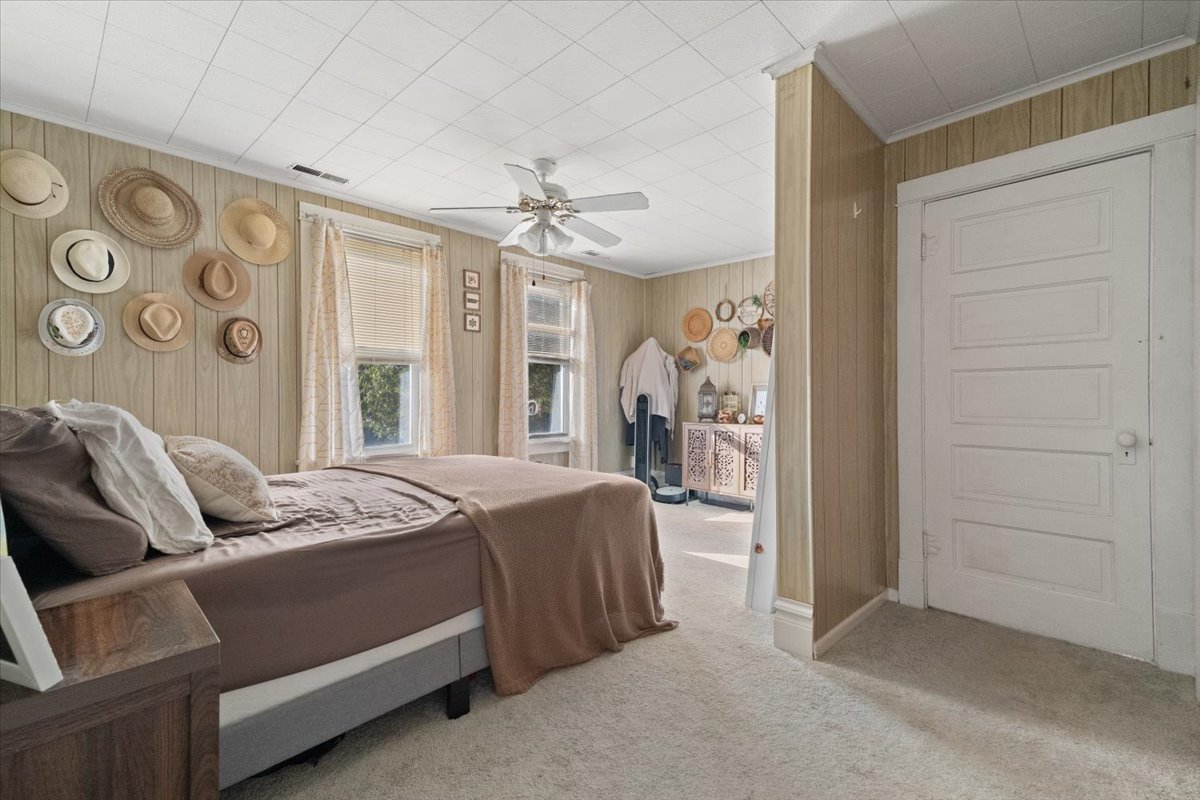 116 East Monaville Road Lake Villa, IL 60046 - Photo 34 of 51 a bedroom with a bed and a chandelier