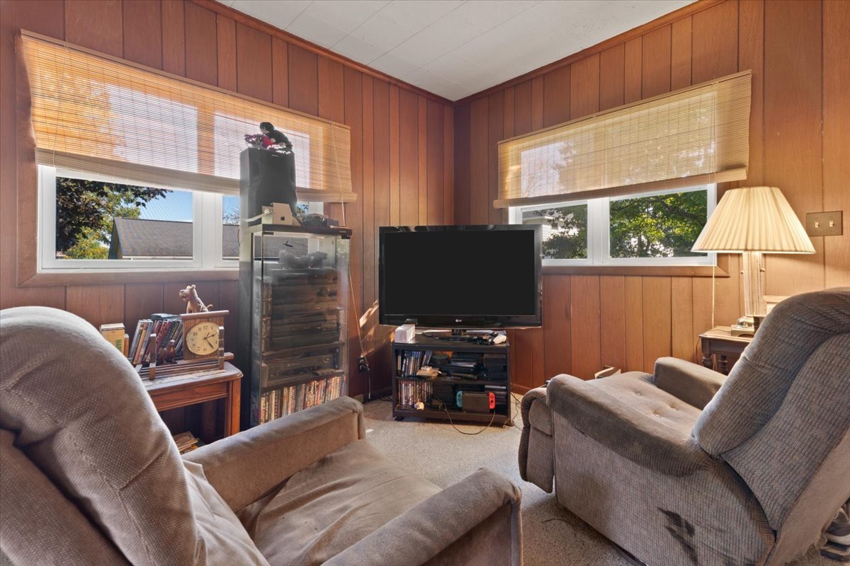 116 East Monaville Road Lake Villa, IL 60046 - Photo 43 of 51 a living room with furniture a window and a flat screen tv