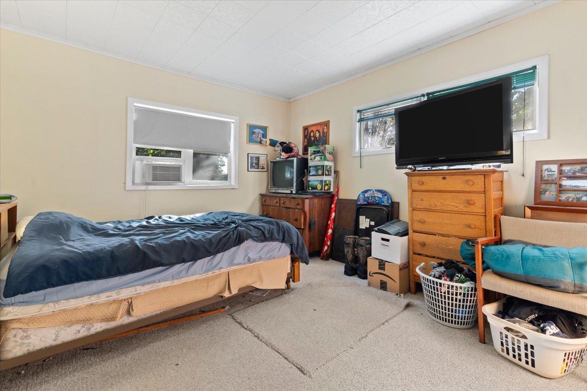 116 East Monaville Road Lake Villa, IL 60046 - Photo 50 of 51 a bedroom with a bed and a flat screen tv