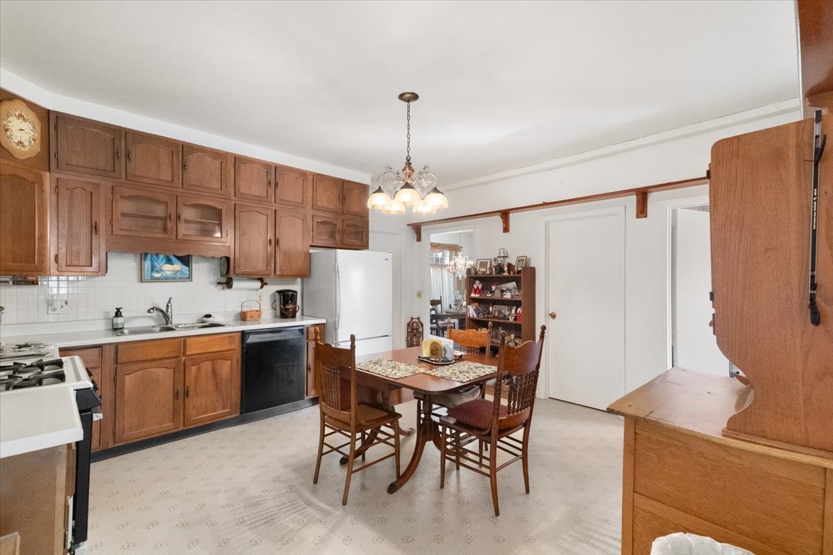 116 East Monaville Road Lake Villa, IL 60046 - Photo 9 of 51 a kitchen with stainless steel appliances granite countertop sink stove top oven and cabinets