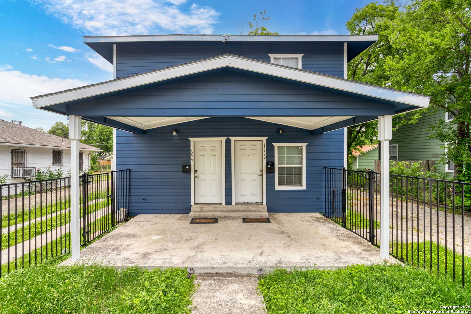 1336 West Ridgewood Court, Unit 1 San Antonio, TX 78201 - Photo 3 of 15 a front view of a house with a yard