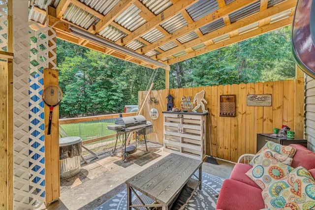 a view of balcony with furniture