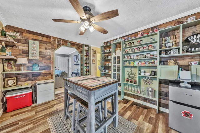 a view of a room with shelves and wooden floor