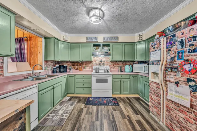 a kitchen with stainless steel appliances granite countertop a stove and cabinets