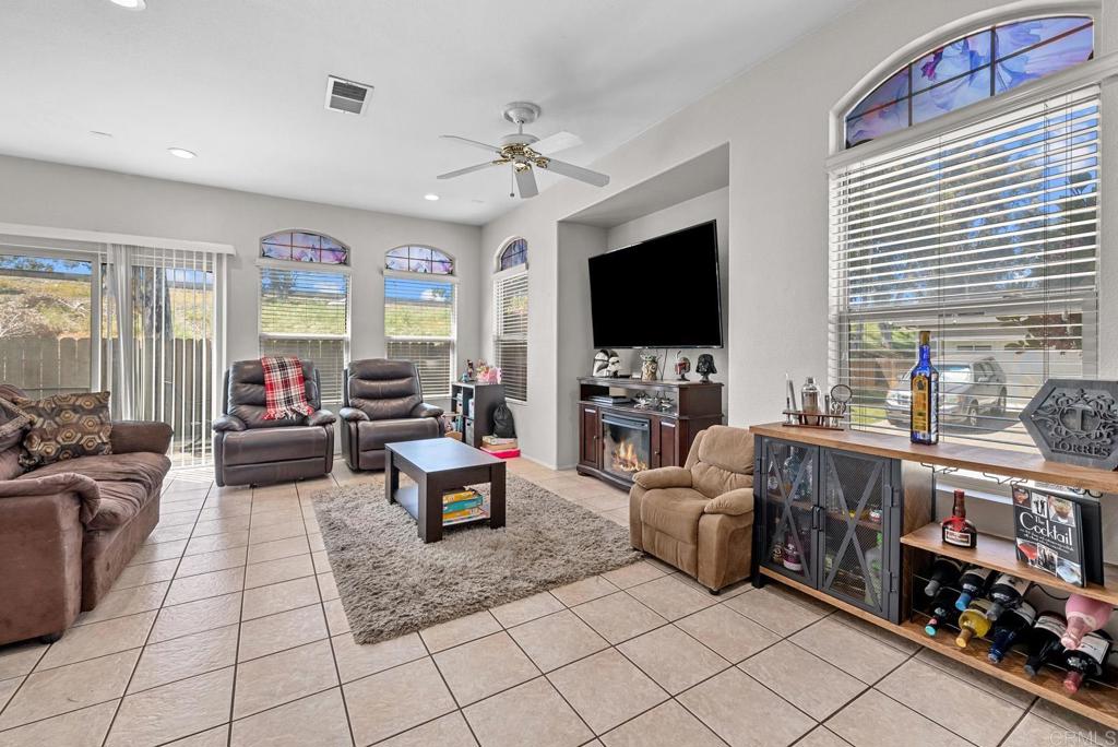 832 Laffey Lane El Cajon, CA 92021 - Photo 11 of 47 a living room with furniture and a flat screen tv