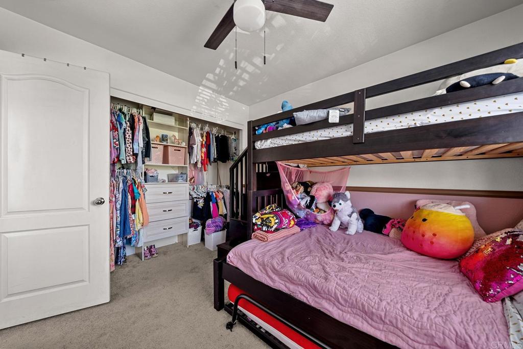 832 Laffey Lane El Cajon, CA 92021 - Photo 18 of 47 a bed room with a bed and a walk in closet