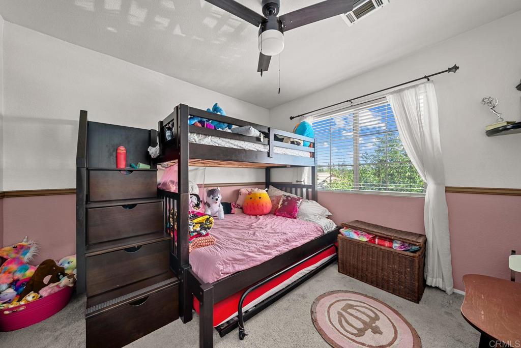 832 Laffey Lane El Cajon, CA 92021 - Photo 19 of 47 a bedroom with a bed and a window