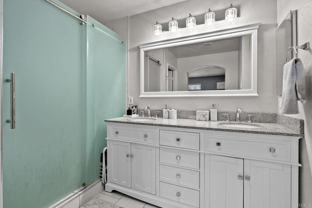 832 Laffey Lane El Cajon, CA 92021 - Photo 25 of 47 a bathroom with a granite countertop sink vanity and mirror
