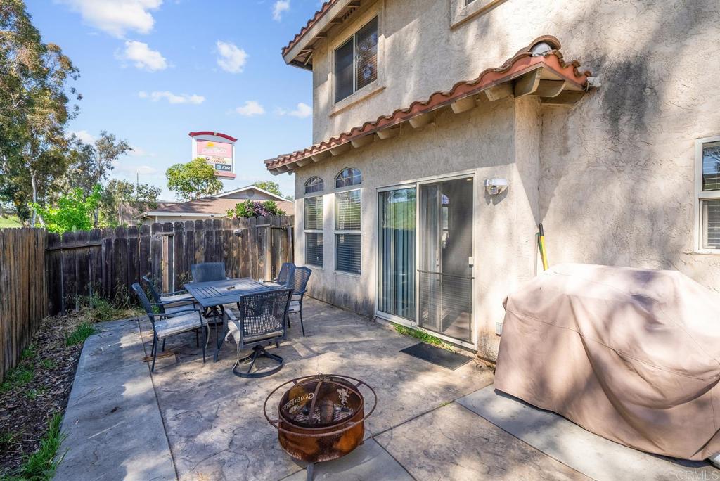 832 Laffey Lane El Cajon, CA 92021 - Photo 33 of 47 a backyard of a house with fire pit and outdoor seating