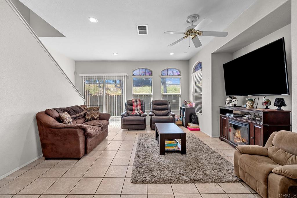 832 Laffey Lane El Cajon, CA 92021 - Photo 5 of 47 a living room with furniture and a flat screen tv