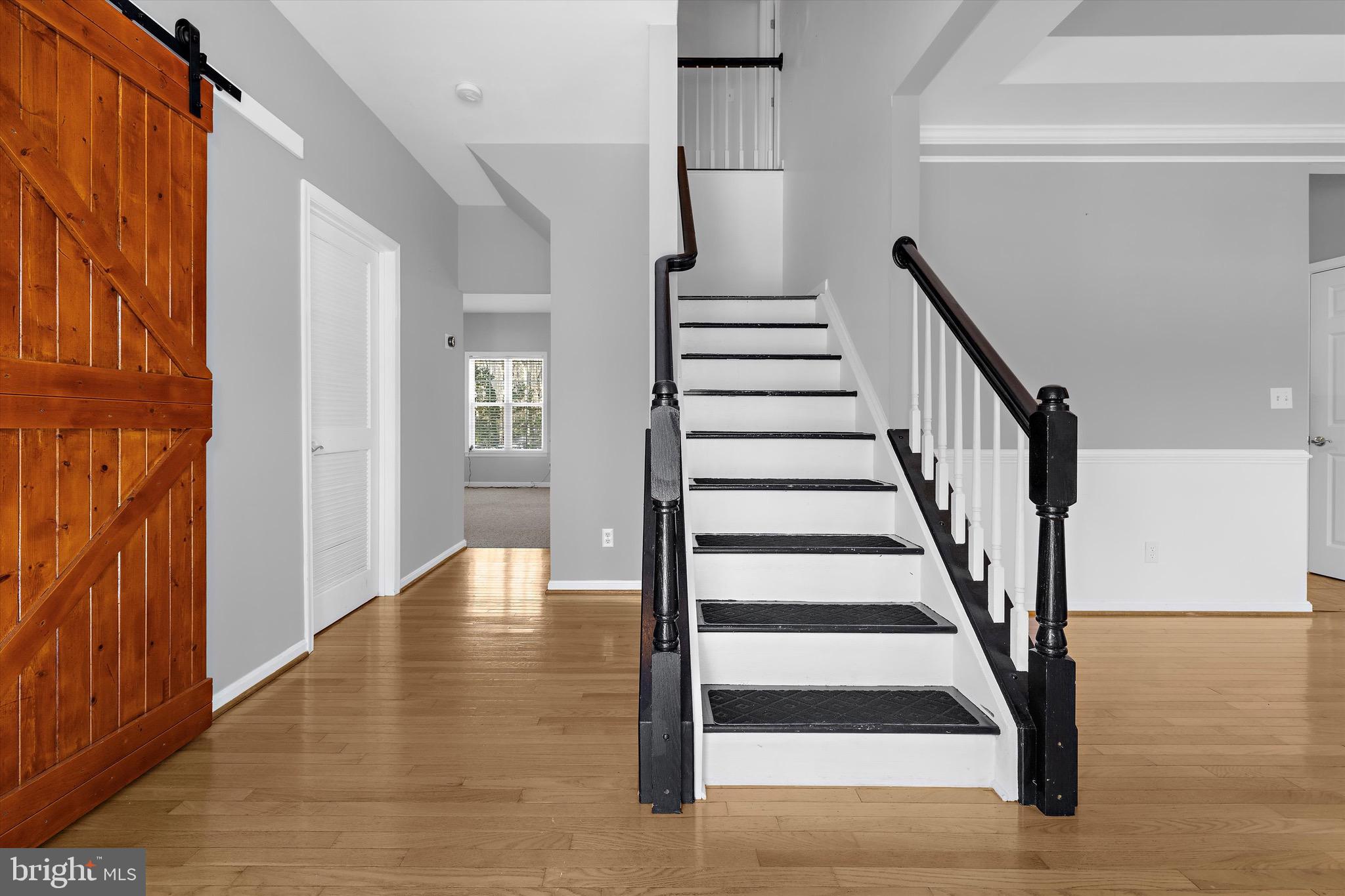 7144 Fir Street Easton, MD 21601 - Photo 14 of 24 a view of entryway with wooden floor and windows