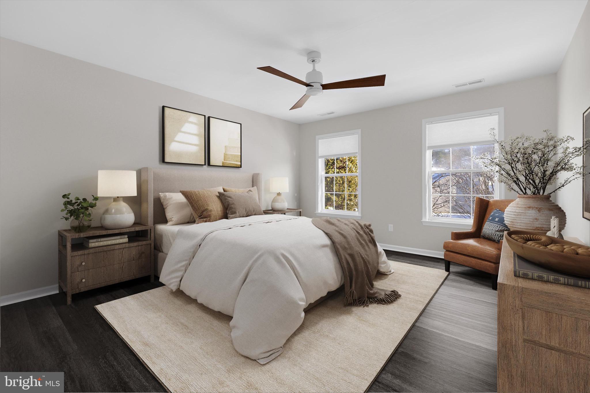 7144 Fir Street Easton, MD 21601 - Photo 15 of 24 a spacious bedroom with a bed and wooden floor