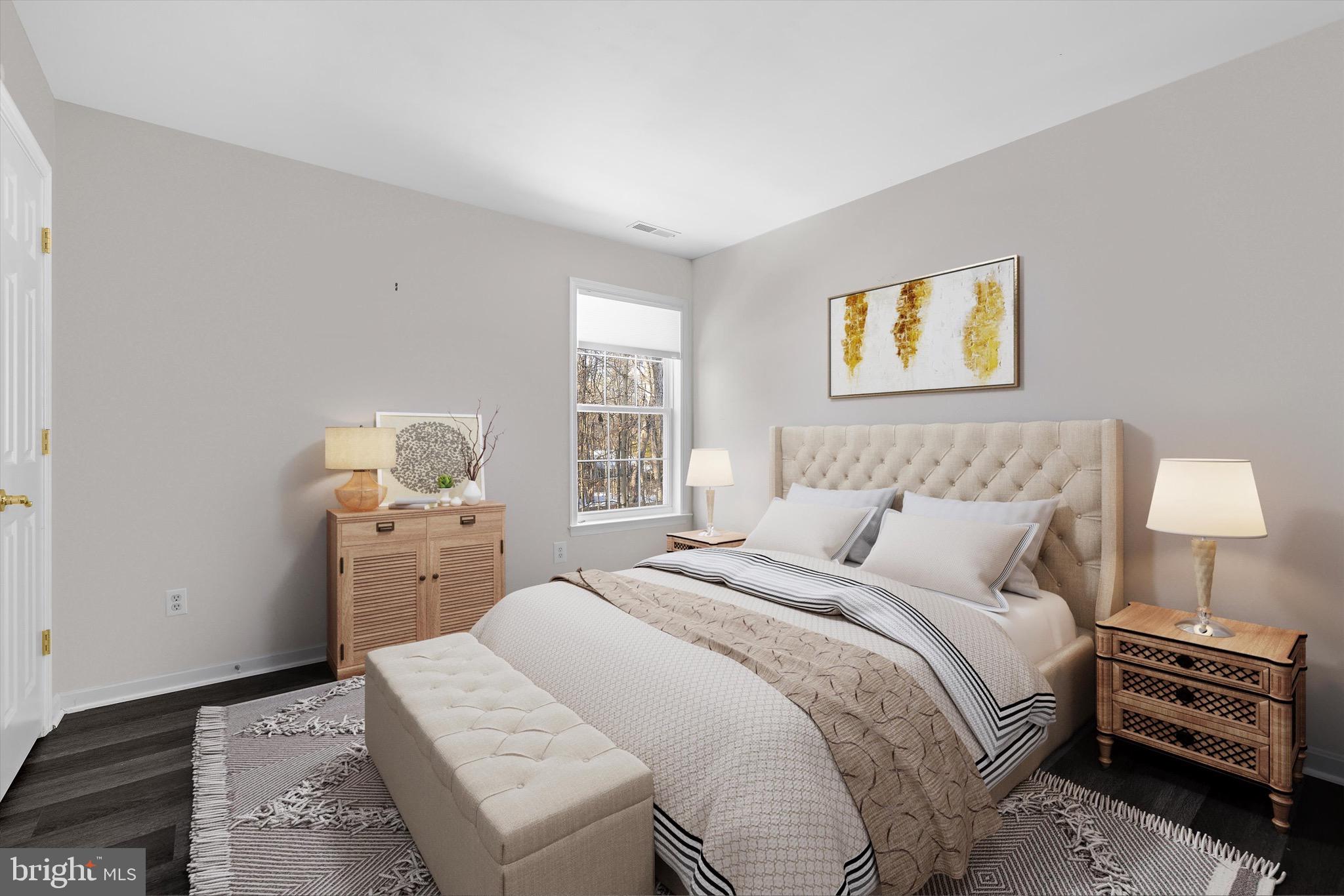 7144 Fir Street Easton, MD 21601 - Photo 18 of 24 a bedroom with a bed and a night stand