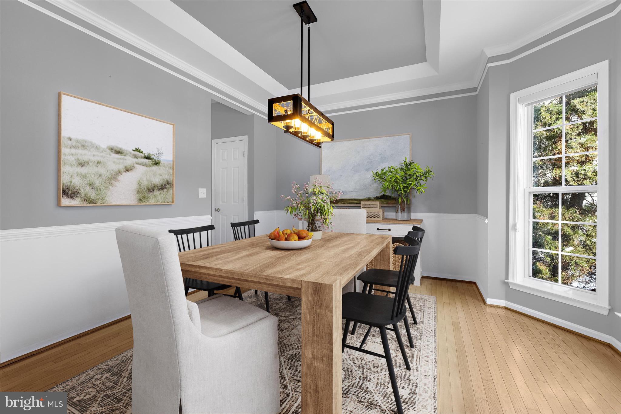 7144 Fir Street Easton, MD 21601 - Photo 3 of 24 a view of a dining room with furniture window and wooden floor