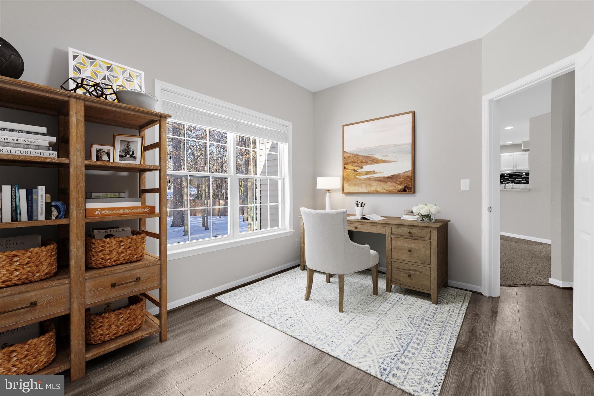 7144 Fir Street Easton, MD 21601 - Photo 8 of 24 a workspace with furniture window and wooden floor