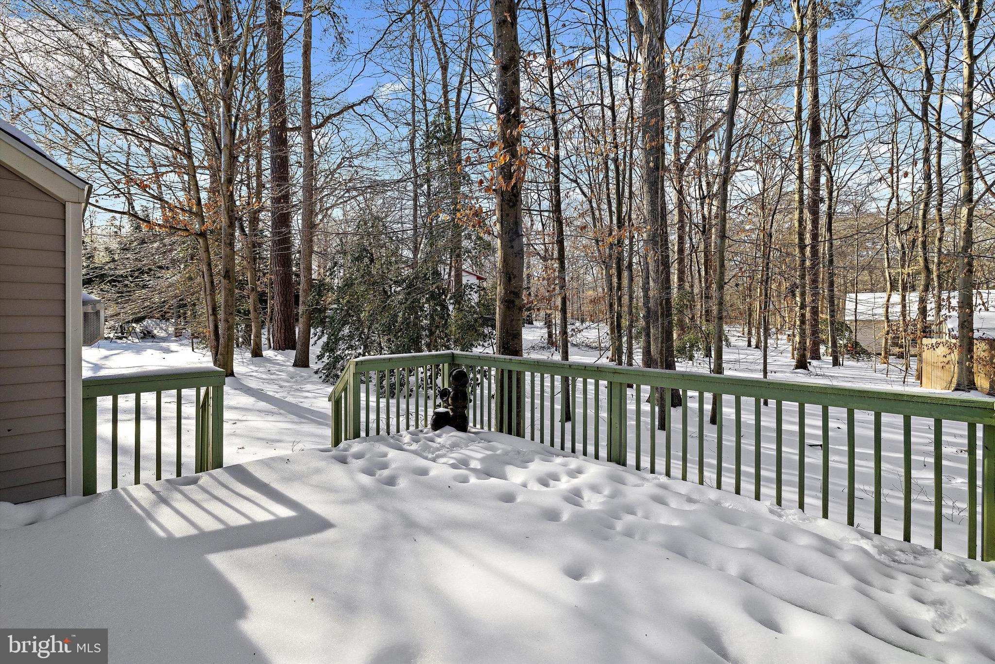 7144 Fir Street Easton, MD 21601 - Photo 10 of 24 a view of a roof deck with wooden fence and floor