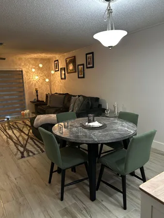 a view of a dining room with furniture