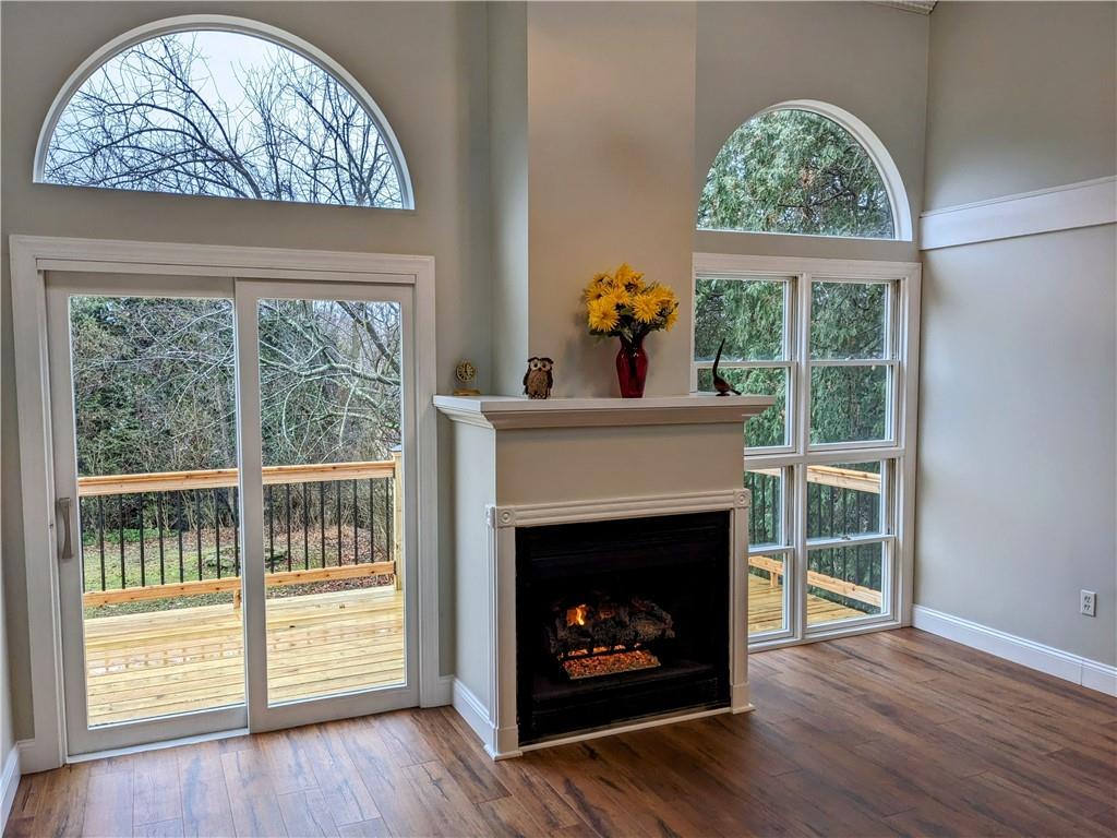 432 Raspberry Drive Monroeville, PA 15146 - Photo 14 of 39 a living room with a fireplace with a window